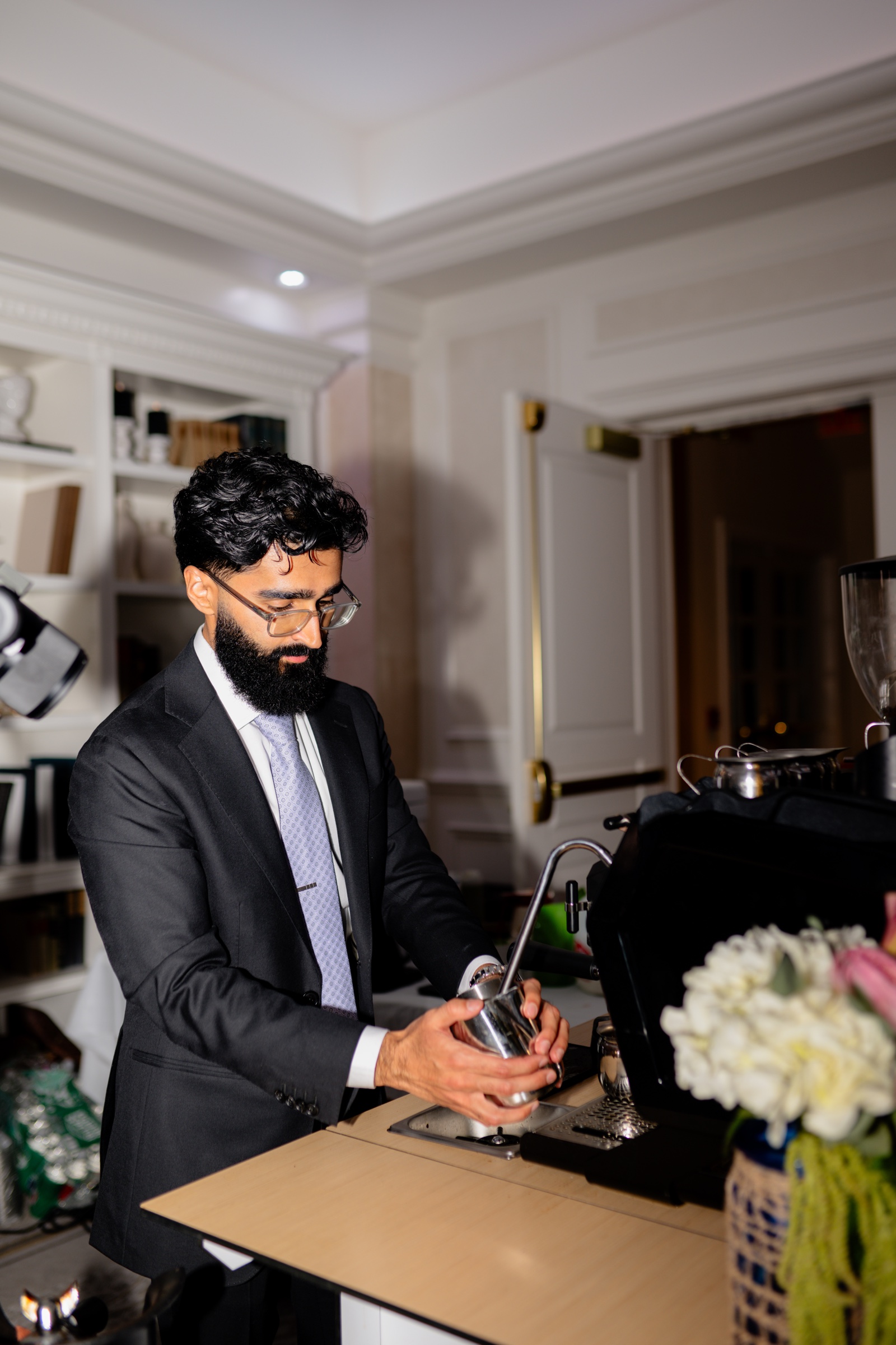 Qadeer Coffee Co barista preparing a fresh drink at an elegant wedding reception