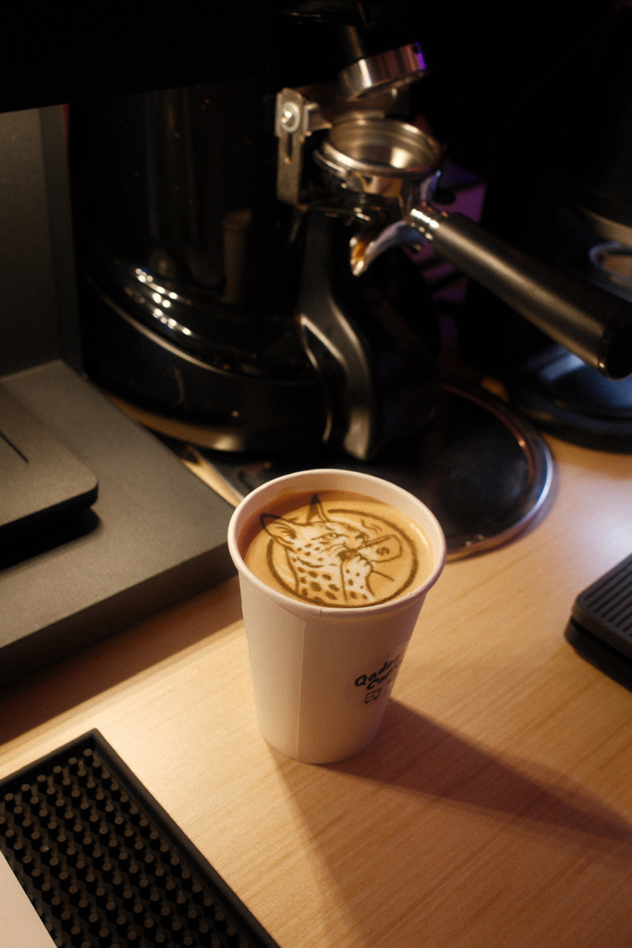 Cheetah artwork printed onto a hot latte by the Qadeer Coffee Co latte art printer